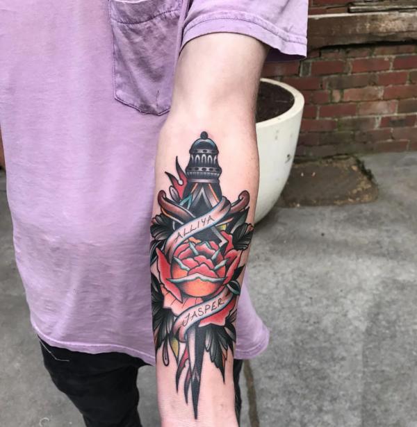 Rose and dagger with names tattoo