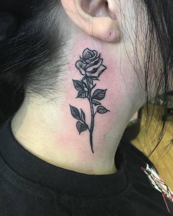 Rose with stem neck tattoo