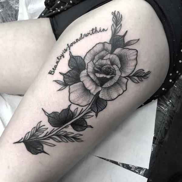 Rose with stem thigh tattoo