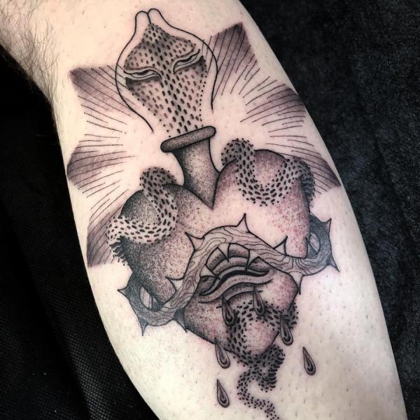 Sacred heart with cobra and barbed wire tattoo