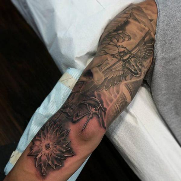 Scarab eye of Ra and Egyptian lotus tattoo
