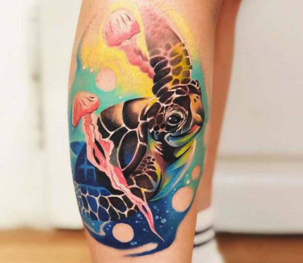 Sea turtle and jellyfish tattoo