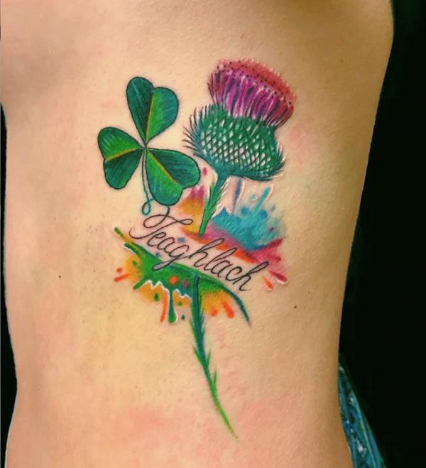 Shamrock and thistle tattoo with word Teaghlach