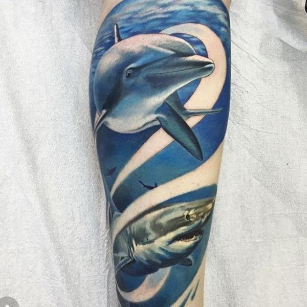 Shark and dolphin tattoo