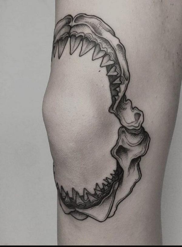 Shark teeth knee tattoo