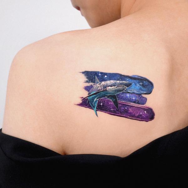 Shark with strokes of galaxy tattoo