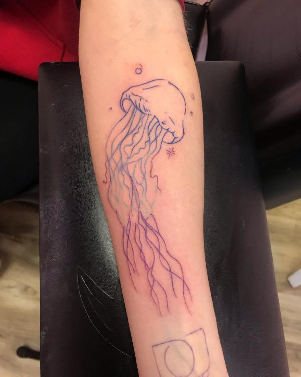 Simple jellyfish line work tattoo