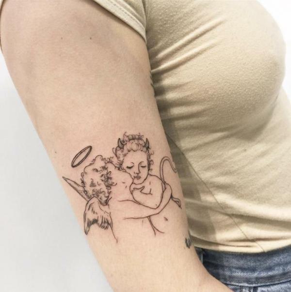 Simple kissing cherub tattoo