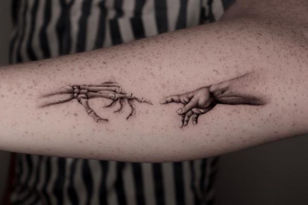 Skeleton Adam hand tattoo