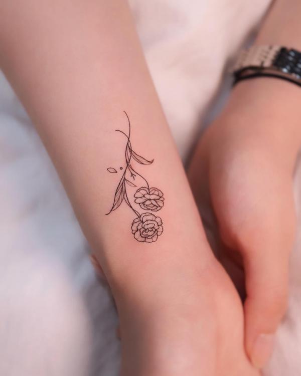 Small marigold outline tattoo