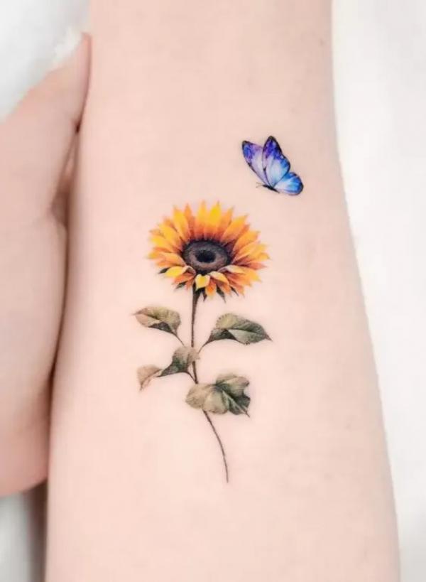 Small sunflower and butterfly tattoo
