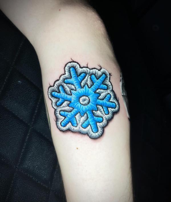Snowflake patch tattoo