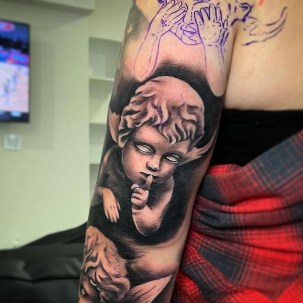Speak no evil cherub tattoo