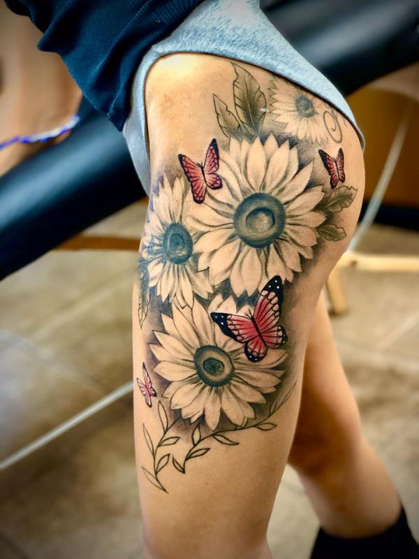 Sunflowers and monarch butterflies thigh tattoo