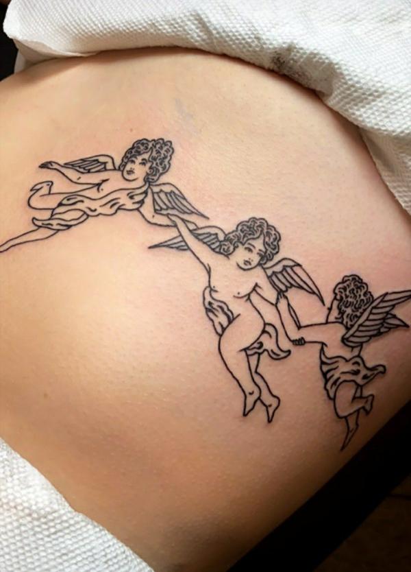 Three dancing cherubs side tattoo