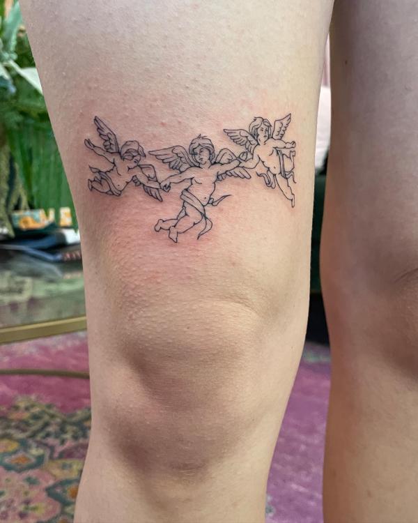 Three dancing cherubs tattoo