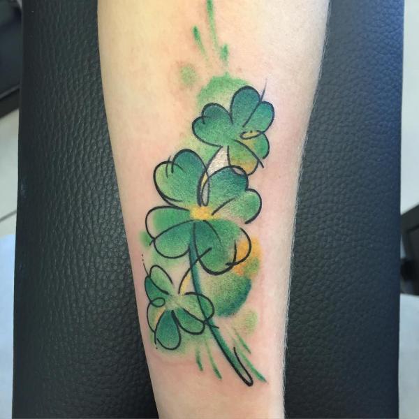 Three leaf and Four leaf clover tattoo