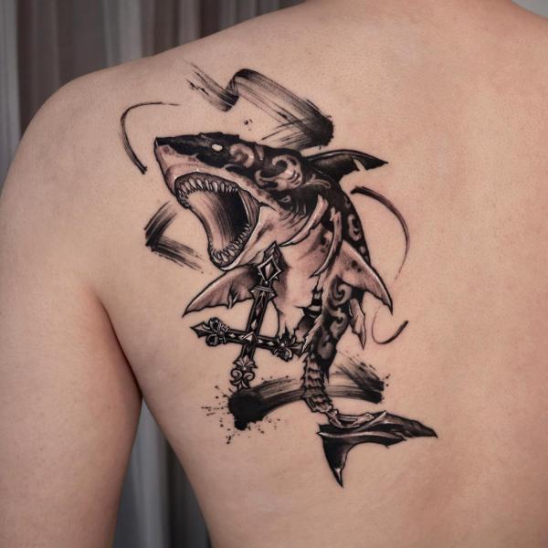 Tiger shark shoulder blade tattoo with brush stroke