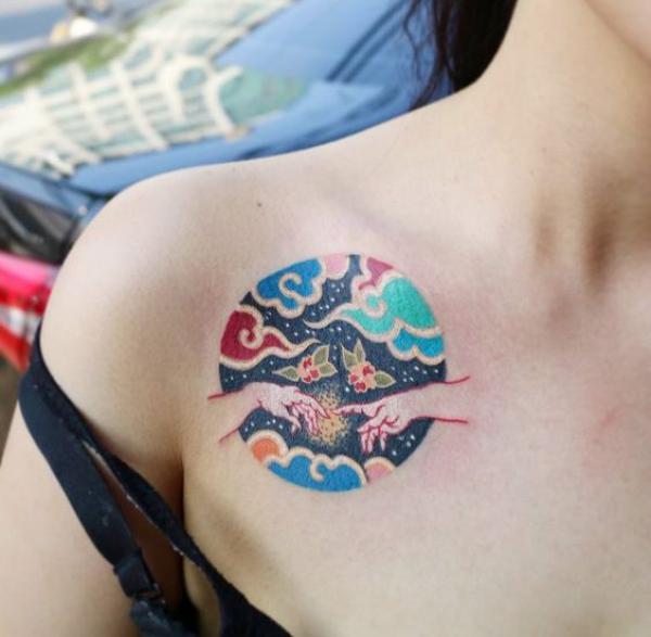 Traditional Adam hands circle tattoo on chest