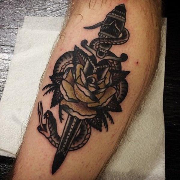 Traditional dagger and rose with snake tattoo in dark theme