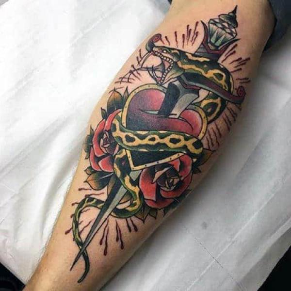 Traditional dagger pierced a heart with rose and snake
