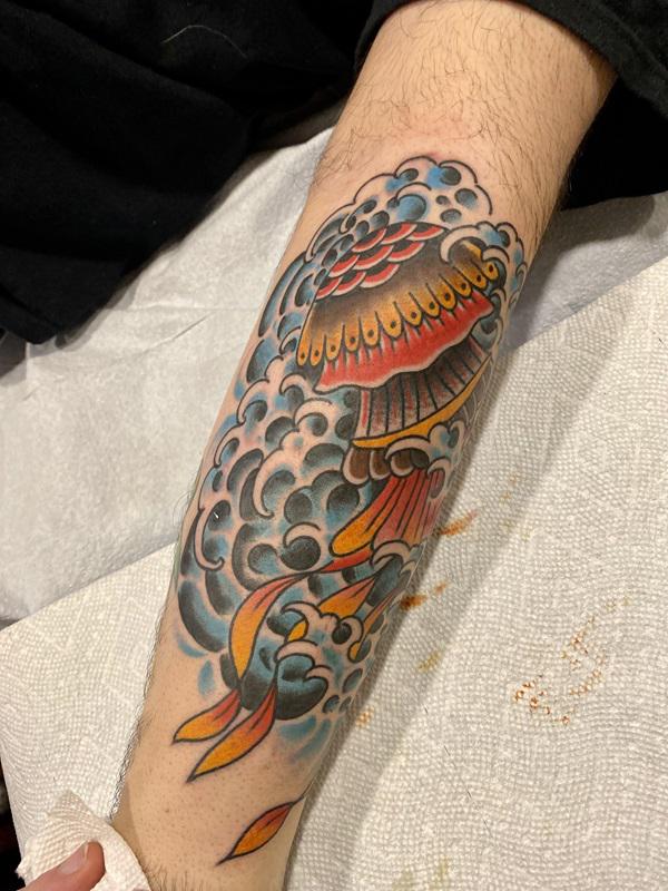 Traditional jellyfish and japanese wave tattoo