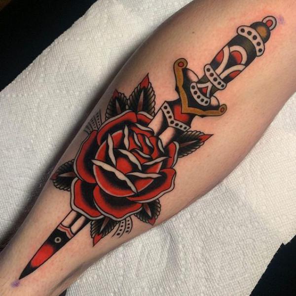 Traditional rose and dagger calf tattoo