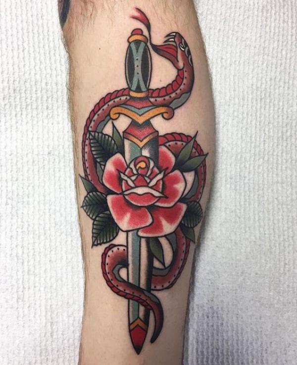 Traditional rose and dagger entwined with a snake tattoo