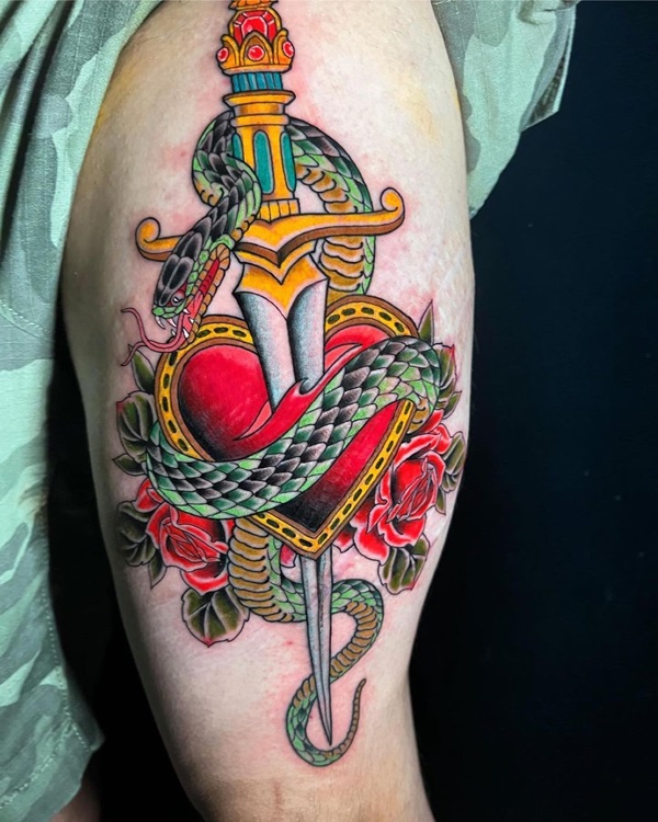 Traditional rose and dagger heart entwined with a snake tattoo