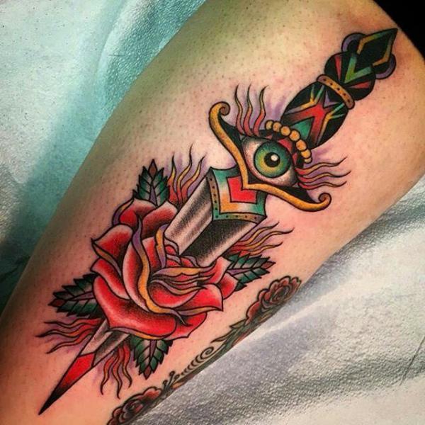 Traditional rose and dagger with eye tattoo