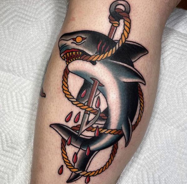 Traditional shark and harpoon tattoo