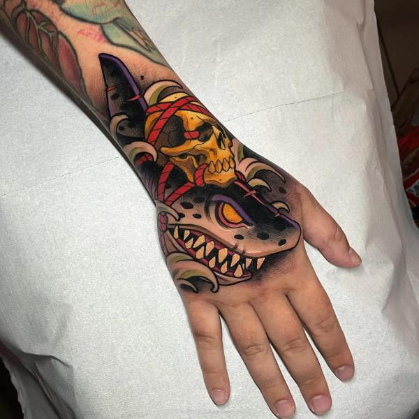 Traditional shark and skull hand tattoo