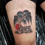 Traditional willow tree at chair and sun tattoo