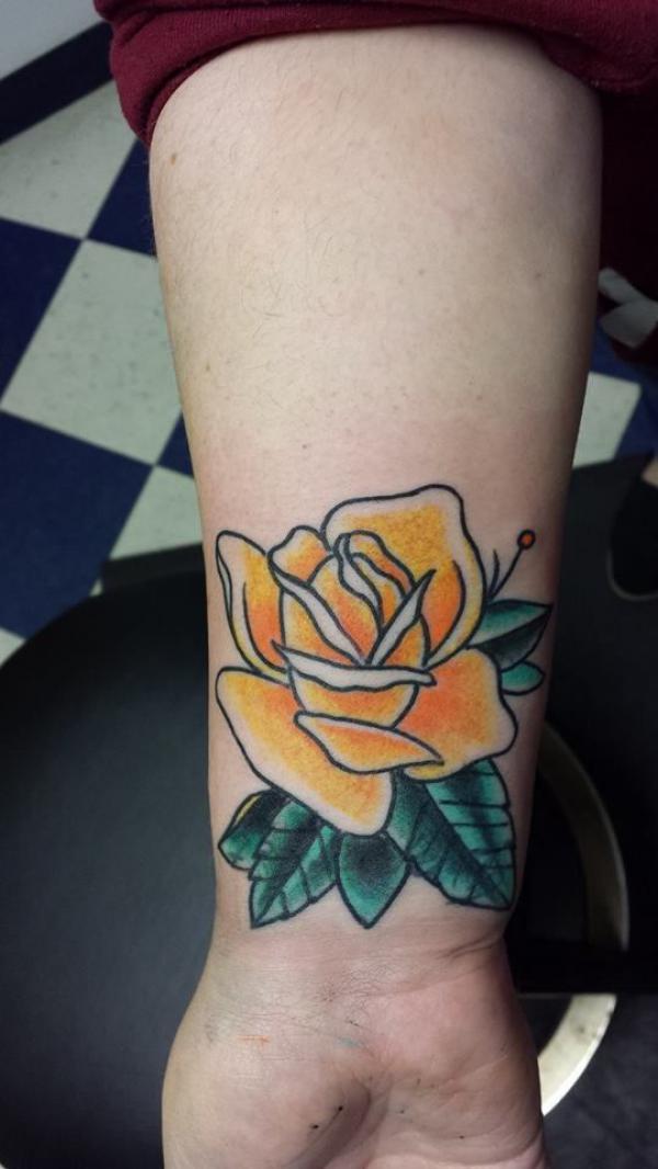 Traditional yellow rose wrist tattoo