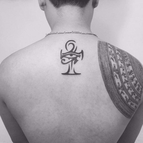 Tribal Ankh and eye of Ra back tattoo