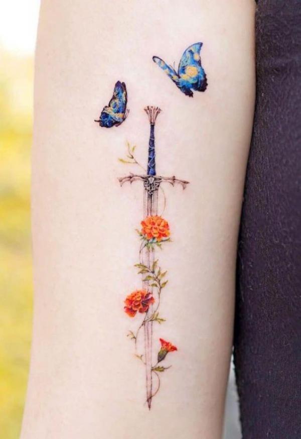 Two butterflies fluttering over a sword entwined with marigold vine
