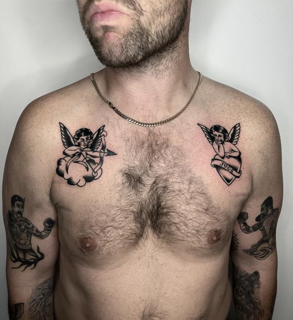 Two cherubs chest tattoo