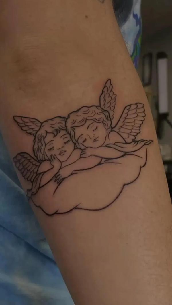 Two cherubs on cloud tattoo