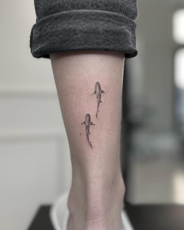 Two minimalist sharks tattoo