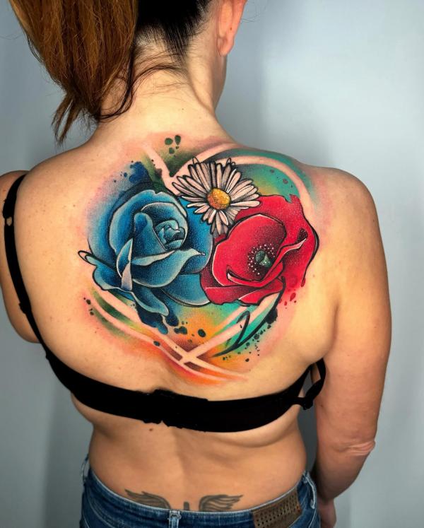 Watercolor blue rose red poppy and white daisy tattoo