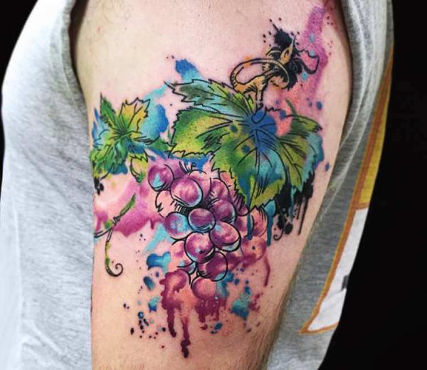 Watercolor grapes and vines tattoo