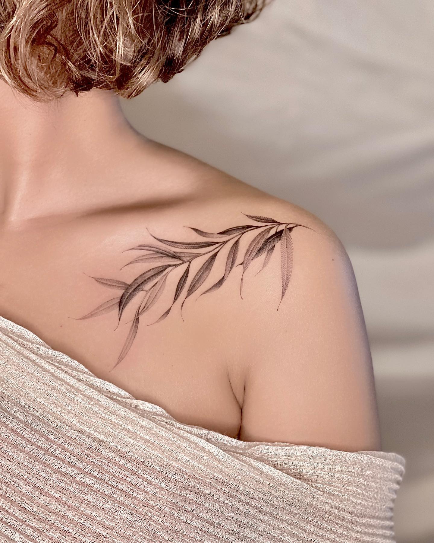 Willow leaves clavicle tattoo