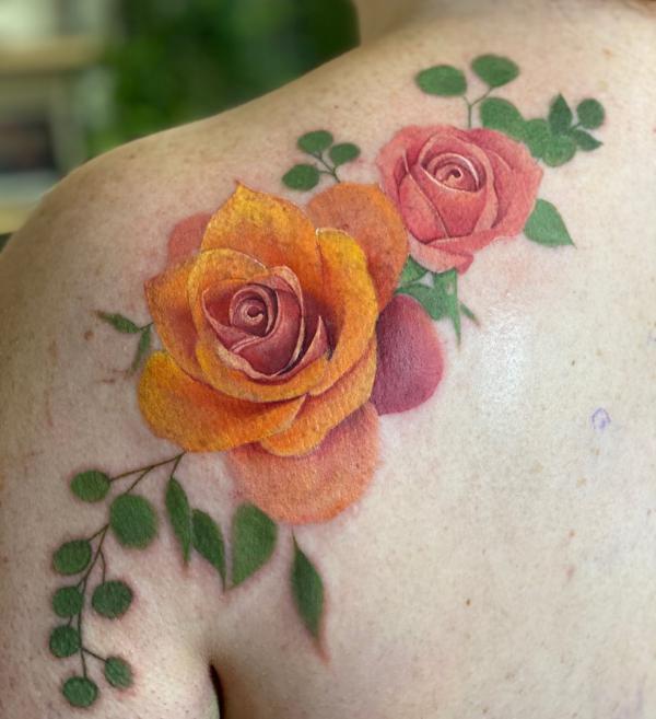 Yellow and pink roses shoulder tattoo