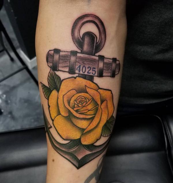 Yellow rose and anchor tattoo