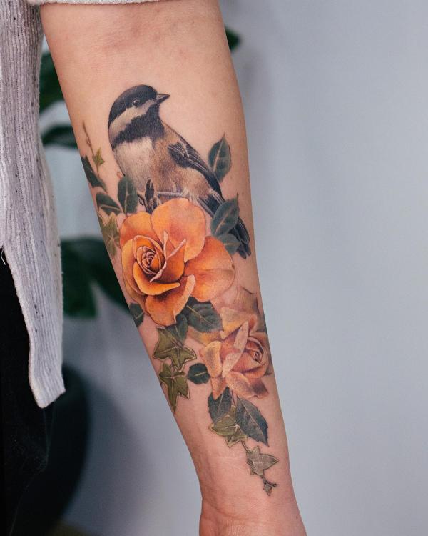 Yellow rose and bird tattoo