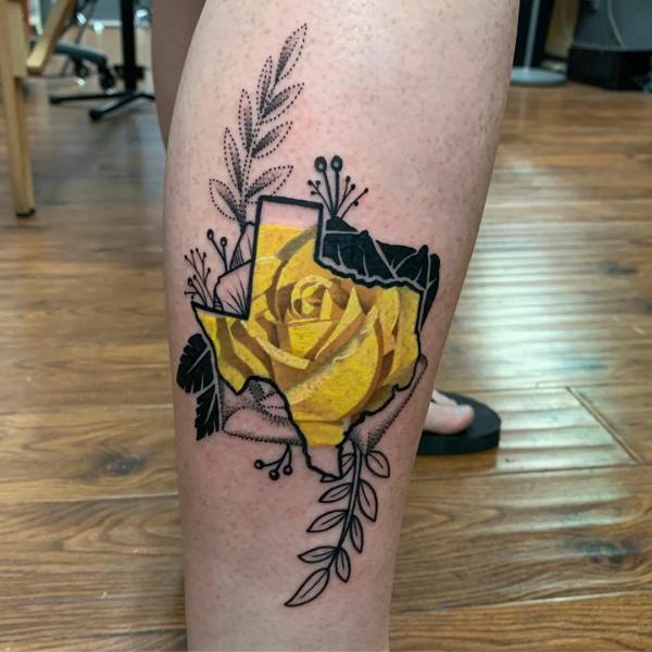 Yellow rose and fern tattoo