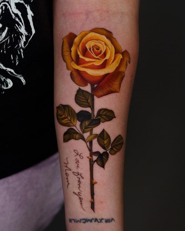 Yellow rose forearm tattoo