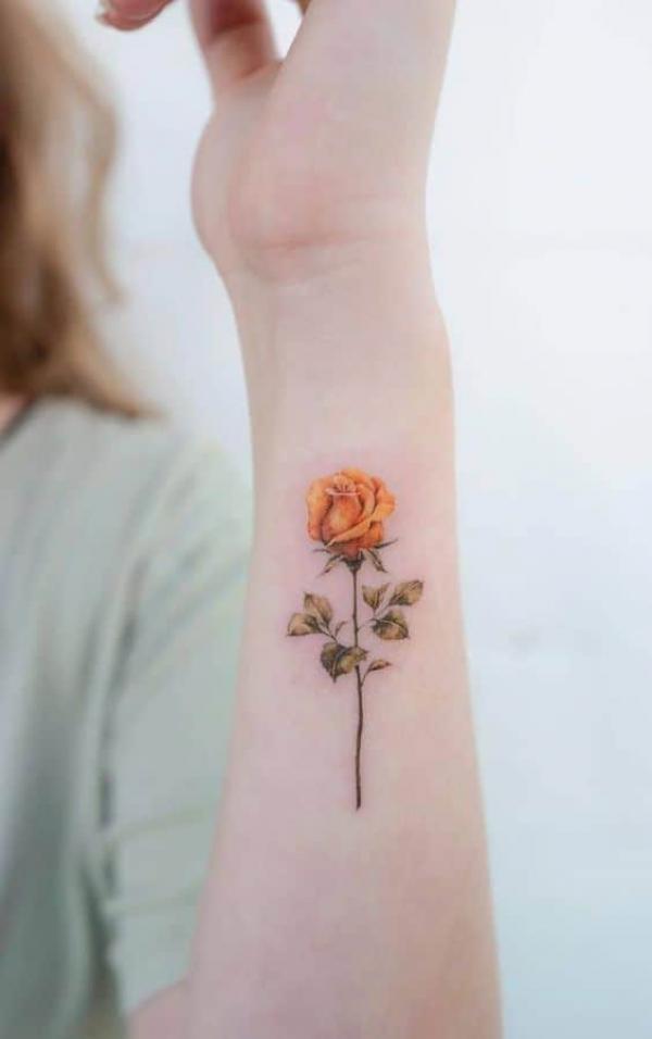 Yellow rose wrist tattoo