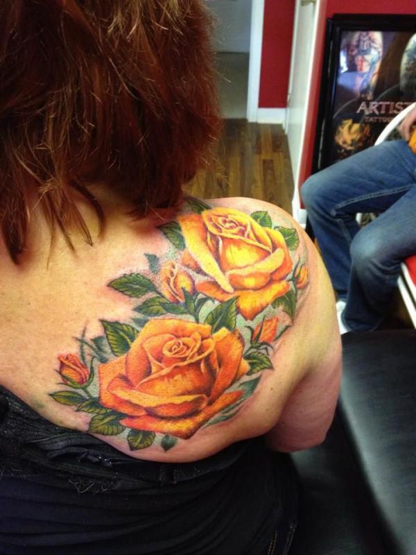 Yellow roses shoulder tattoo