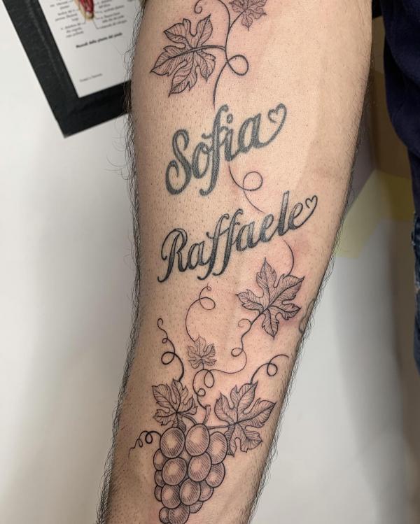 black and white grape tattoo with name